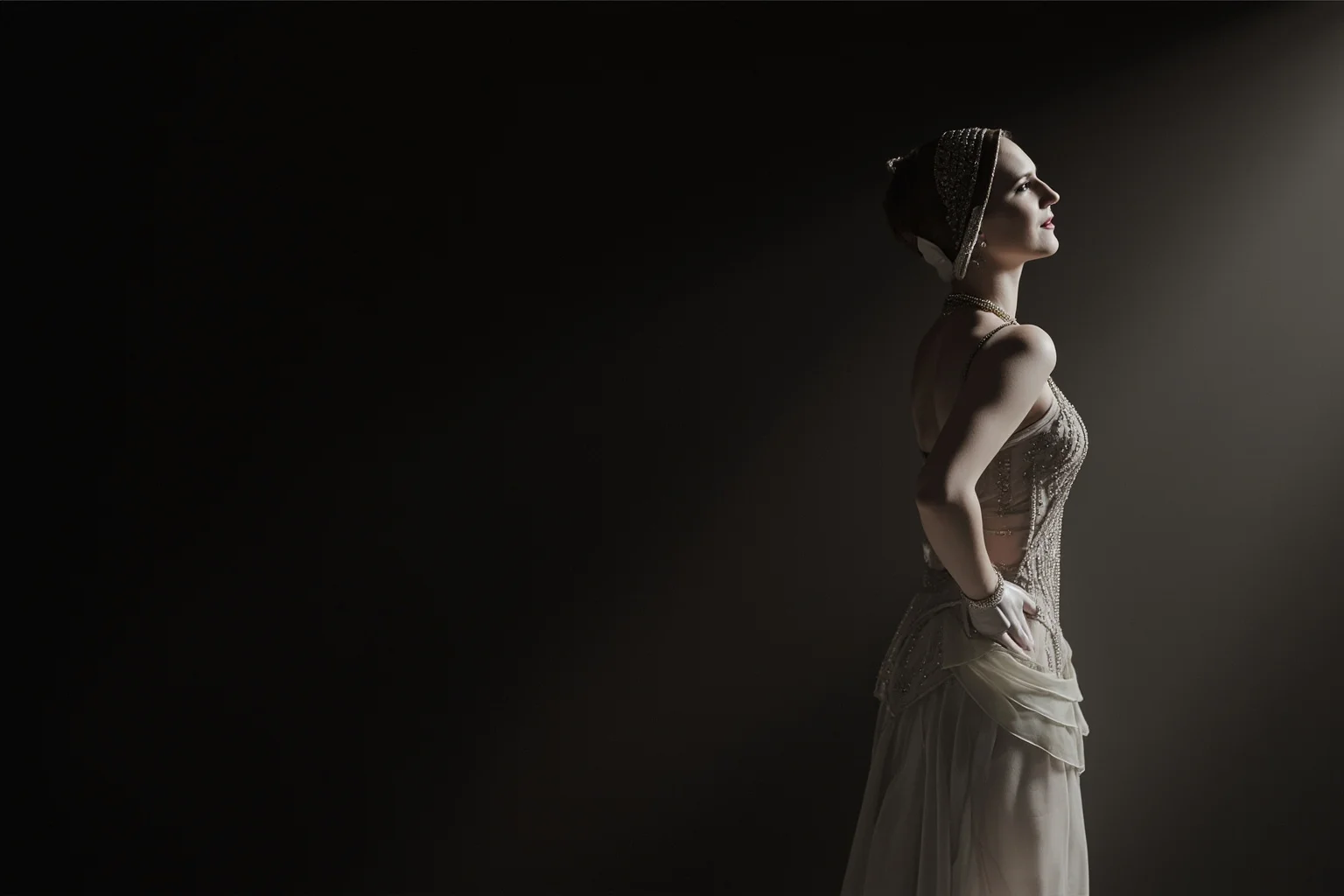 A 1910s-style European woman in elegant dance costume standing in shadow, evoking WWI-era intrigue, illustrated style