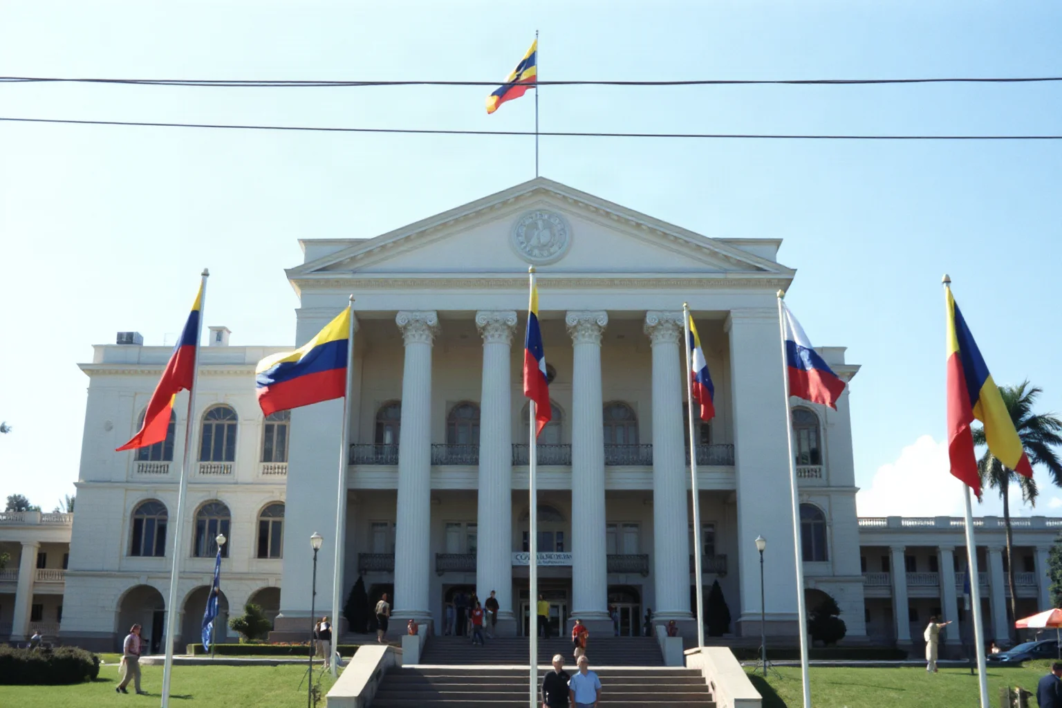 A 1980s Colombian government building with flags, symbolizing a brief and controversial political career