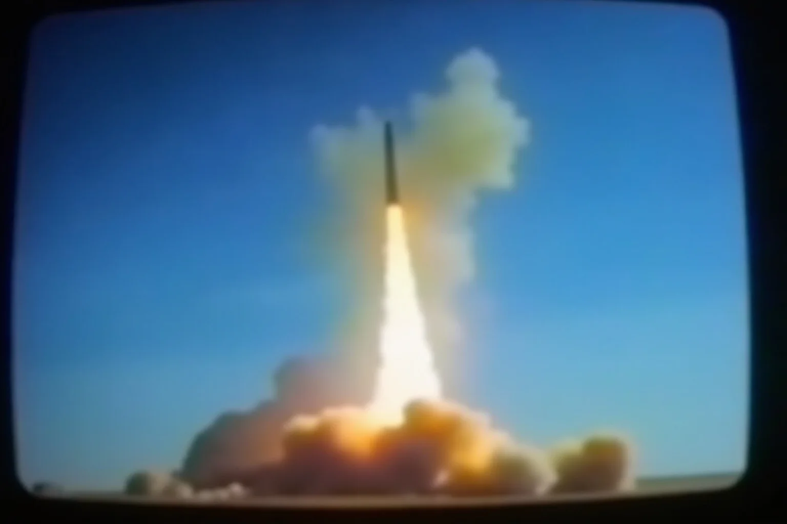 Most Important Historical Events Televised Live 12 A 1980s TV screen showing a rocket launch with a plume of smoke against a blue sky, captured mid-broadcast