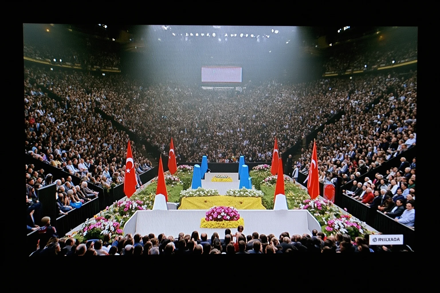 Most Important Historical Events Televised Live 21 A 2000s television broadcast showing a large indoor memorial arena filled with mourners and a stage draped in flowers