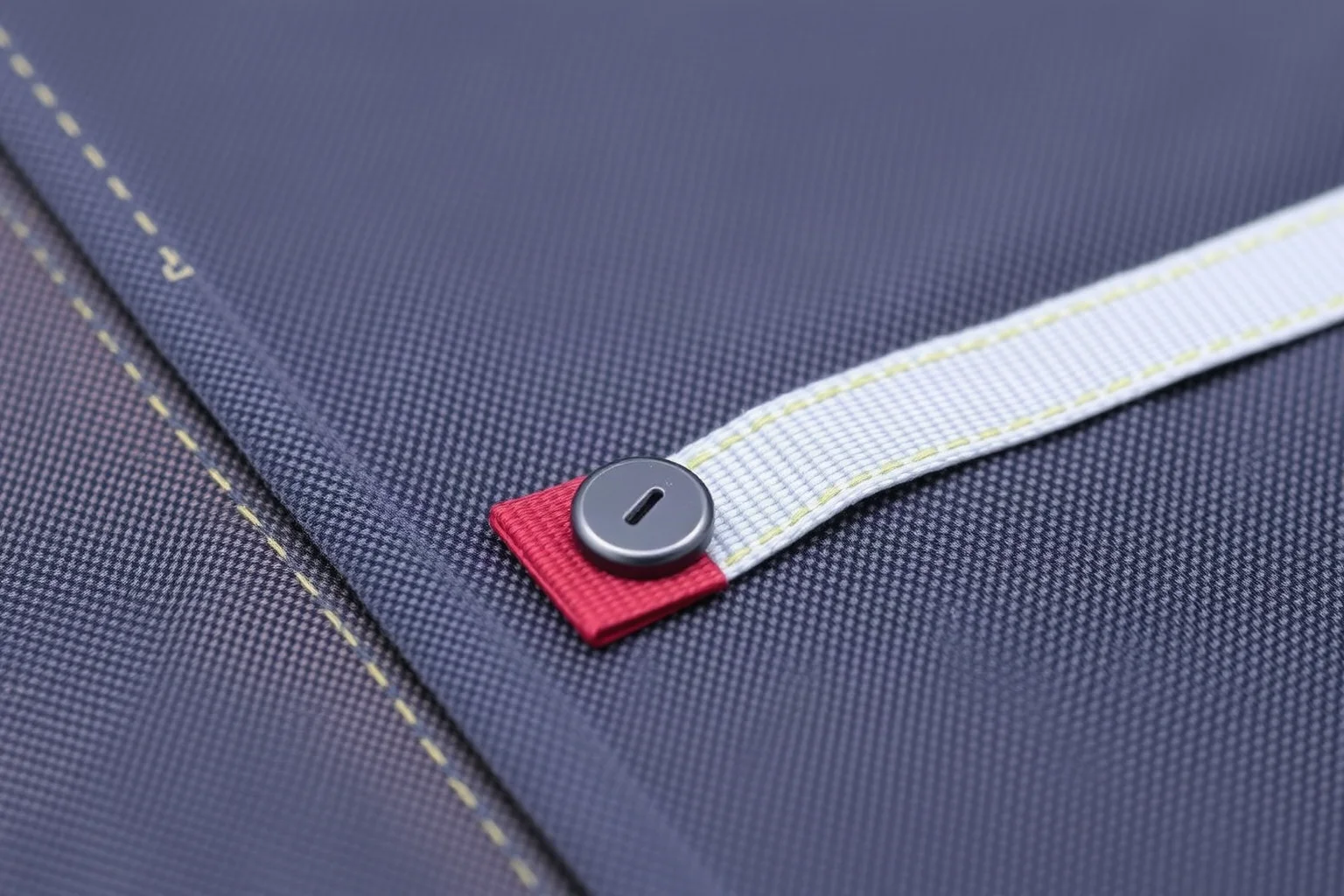 A close-up of hook-and-loop fabric fastener strips, one attached to fabric