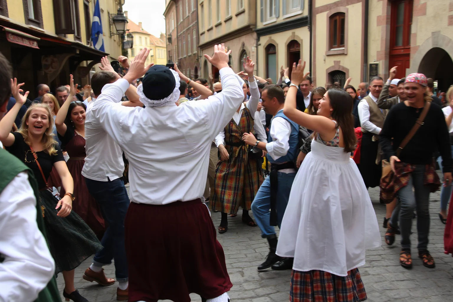 A crowd of medieval townspeople dancing wildly in a European cobblestone street, 16th-century style