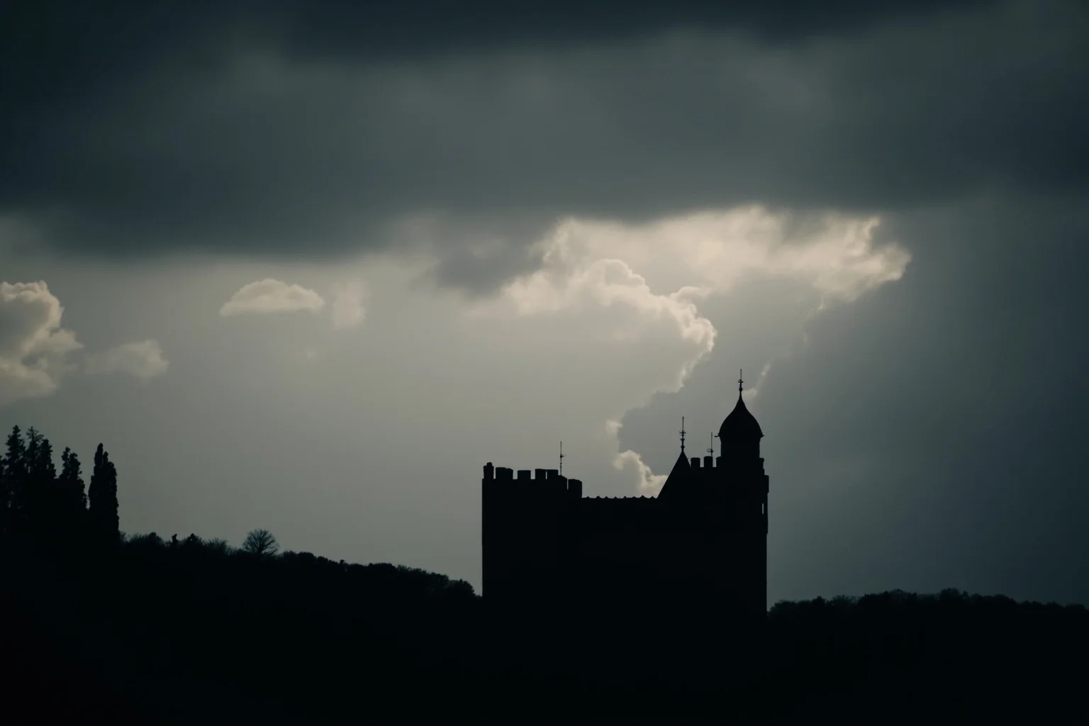 26 Facts About Nostradamus and His Predictions 13 A dramatic cloudy sky over a silhouetted European castle, symbolizing looming historical events