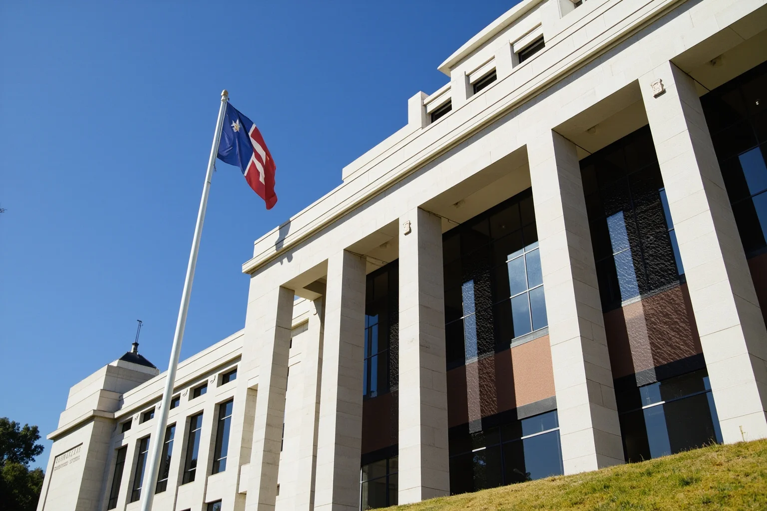 A federal building exterior with memorial-style architecture, evoking remembrance rather than violence