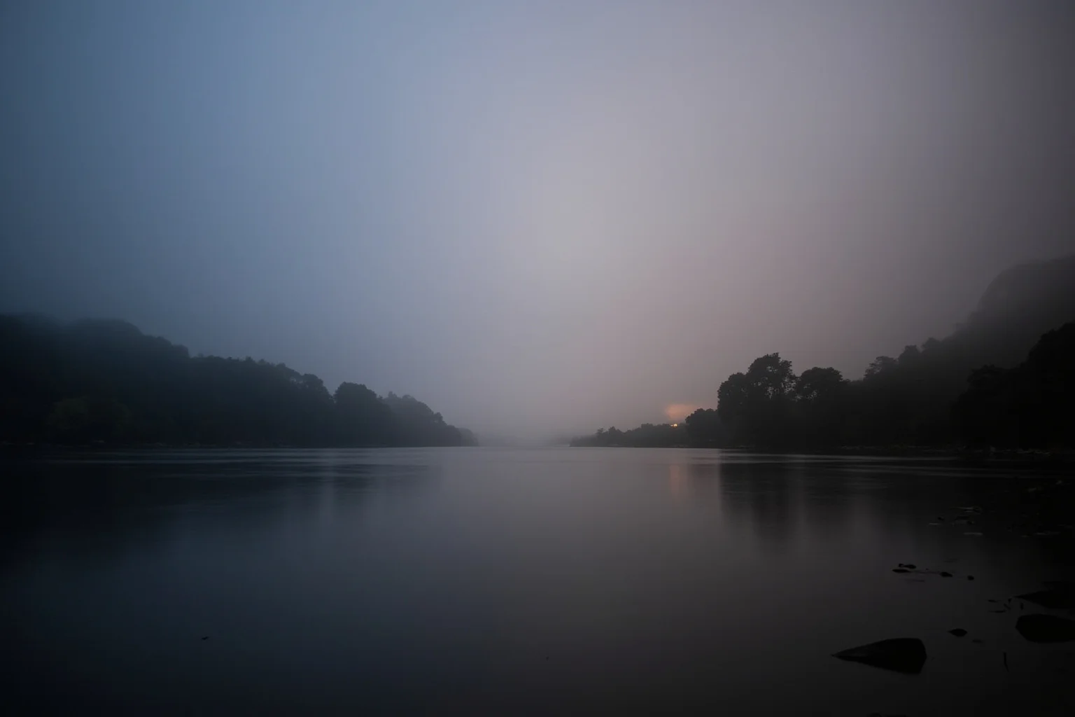 A foggy California riverbank at dawn, evoking an unsolved missing person case