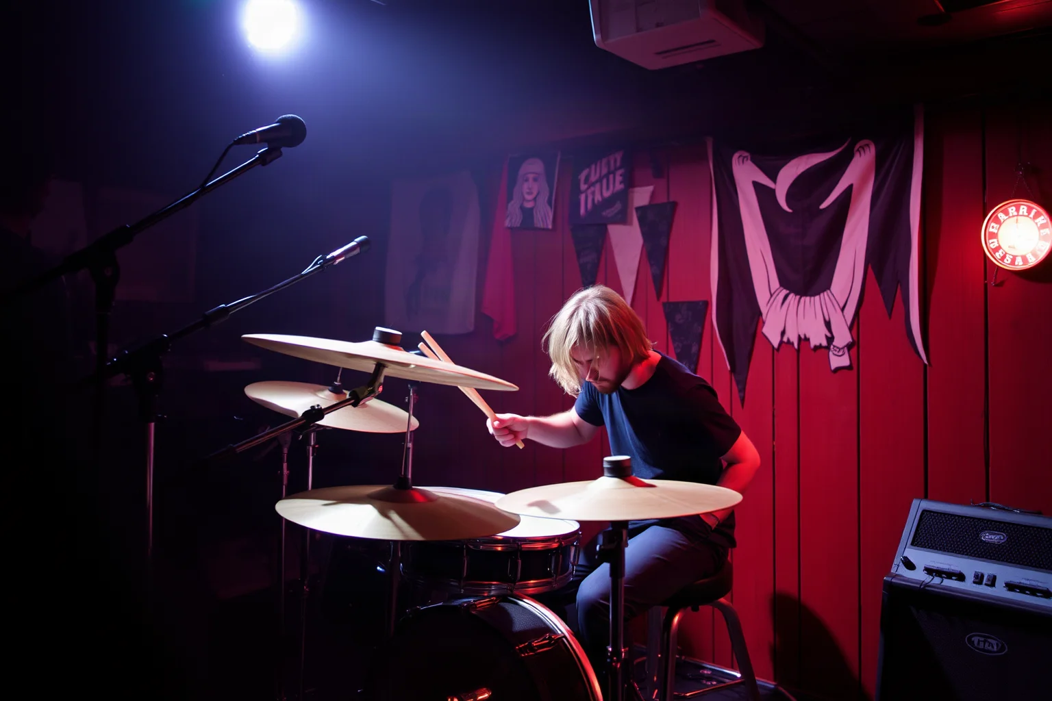 A grunge-era drummer playing with raw intensity in a small, gritty concert venue