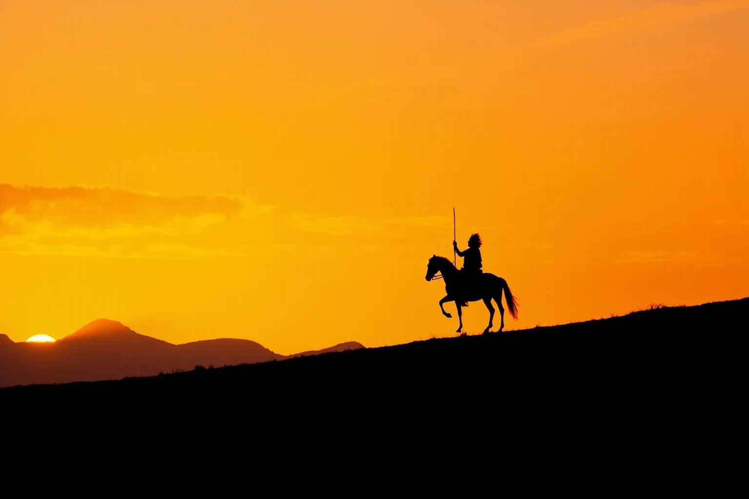 22 Inspiring Stories From Native American History 8 A lone Native American warrior on horseback silhouetted against a sunset ridge