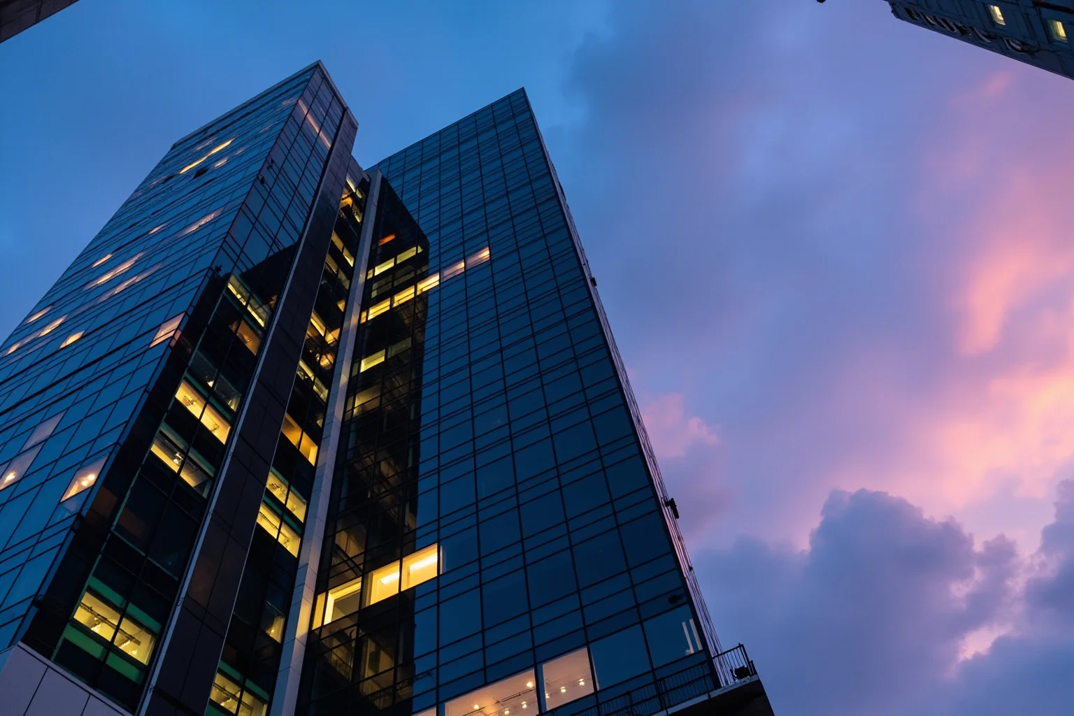 Legendary Cases Involving the Pinkerton Detective Agency 21 A modern corporate office tower exterior at dusk symbolizing a company merger