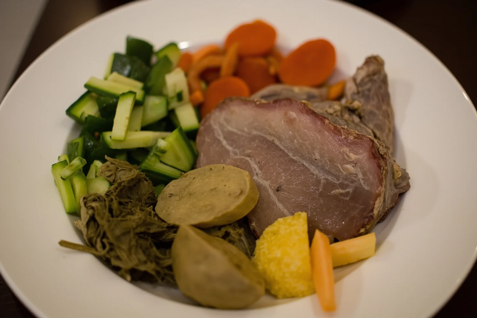 The Evolution of World War 1 Rations: 24 Facts About Food, Trenches, and Rationing 18 A plate of simple wartime food showing limited fresh vegetables and preserved meat, representing monotonous trench nutrition