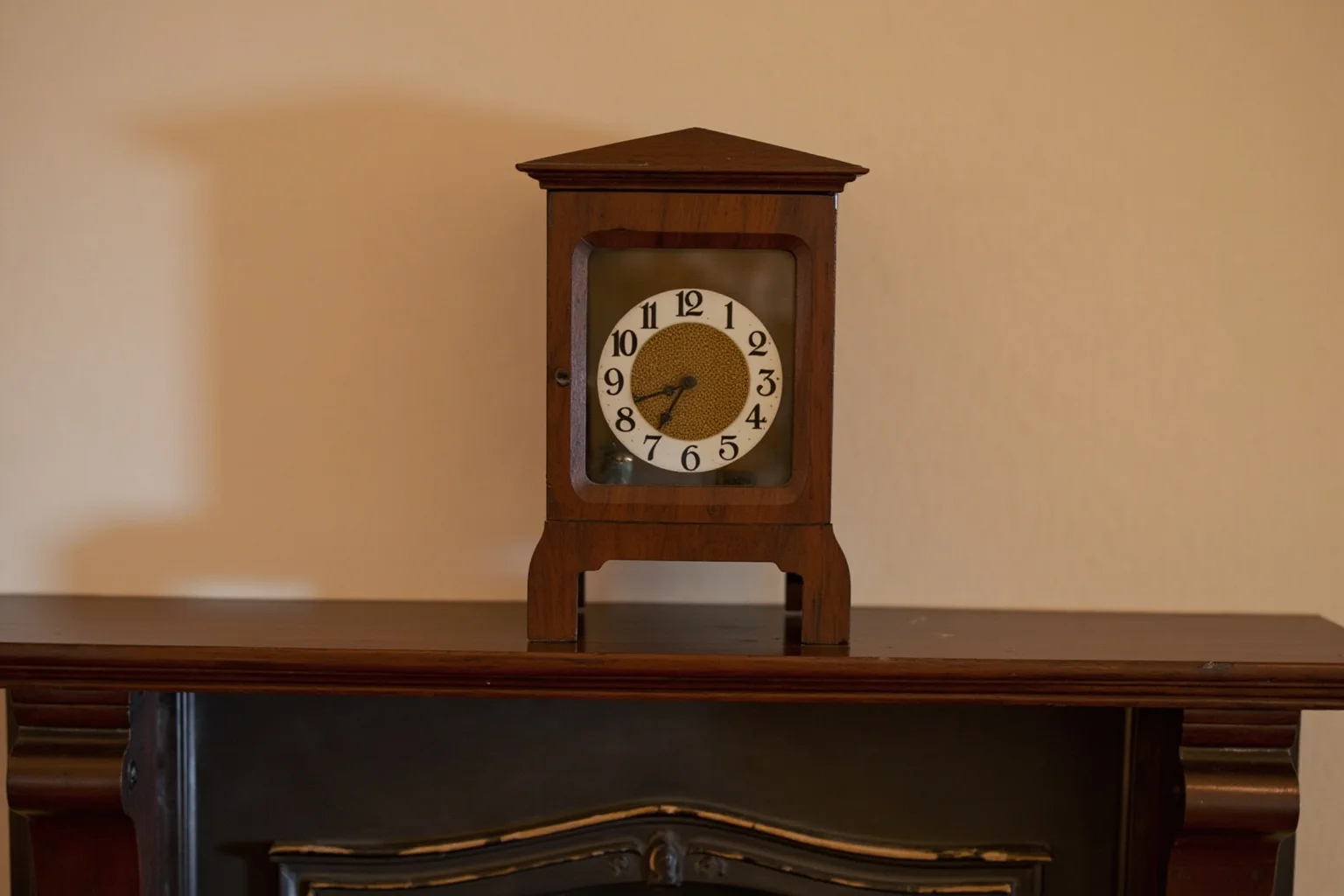 22 Things Every American Home Had in the 1920s 22 A polished wooden mantel clock displayed above a fireplace in a 1920s living room