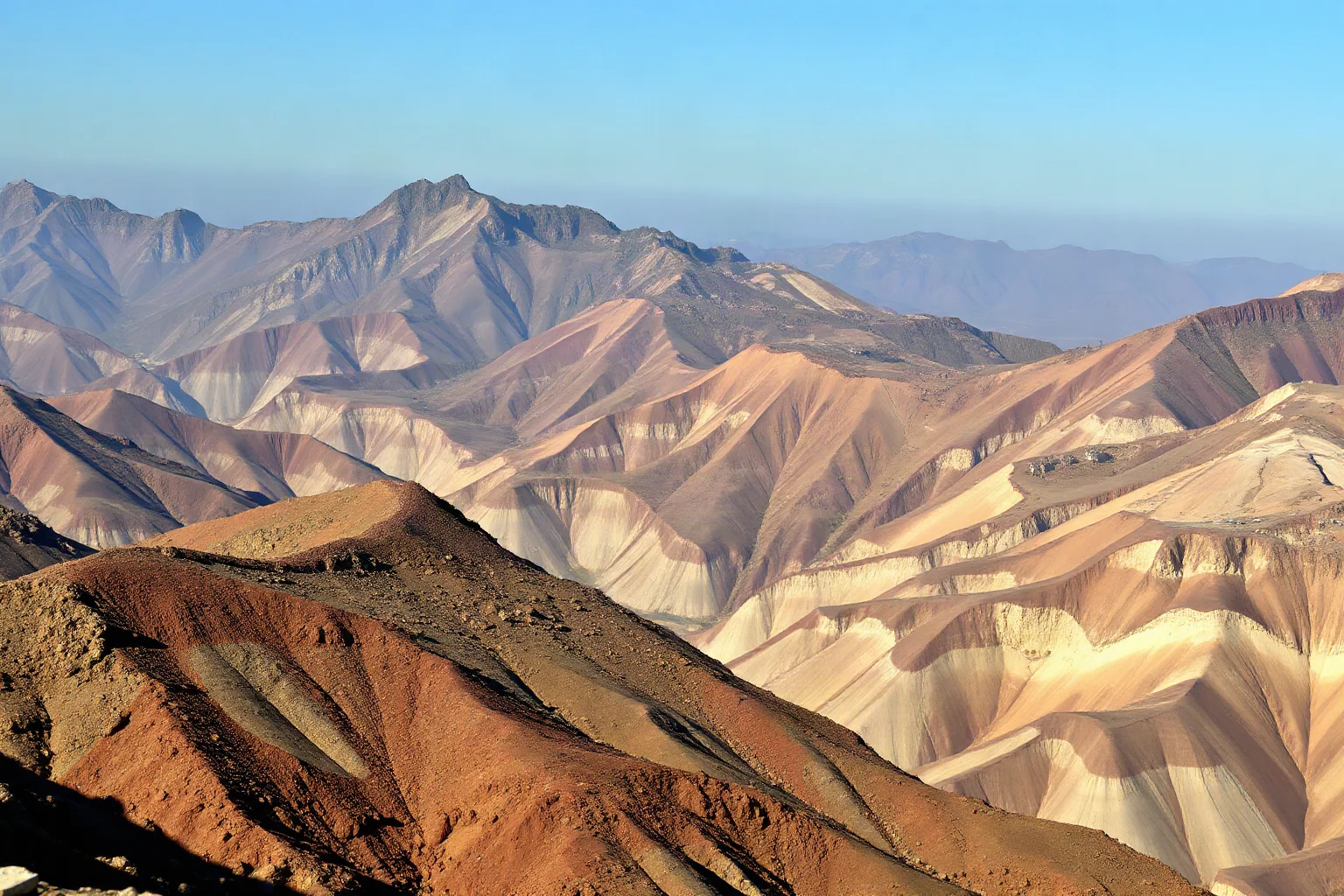 A remote mountainous earthquake zone with landslides reshaping valleys and rivers, painted in muted earth tones