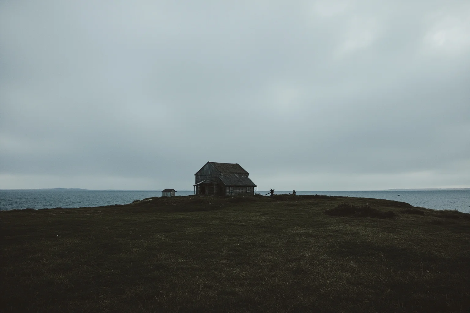A remote windswept island cottage under gray skies, evoking exile and isolation, early 19th-century style