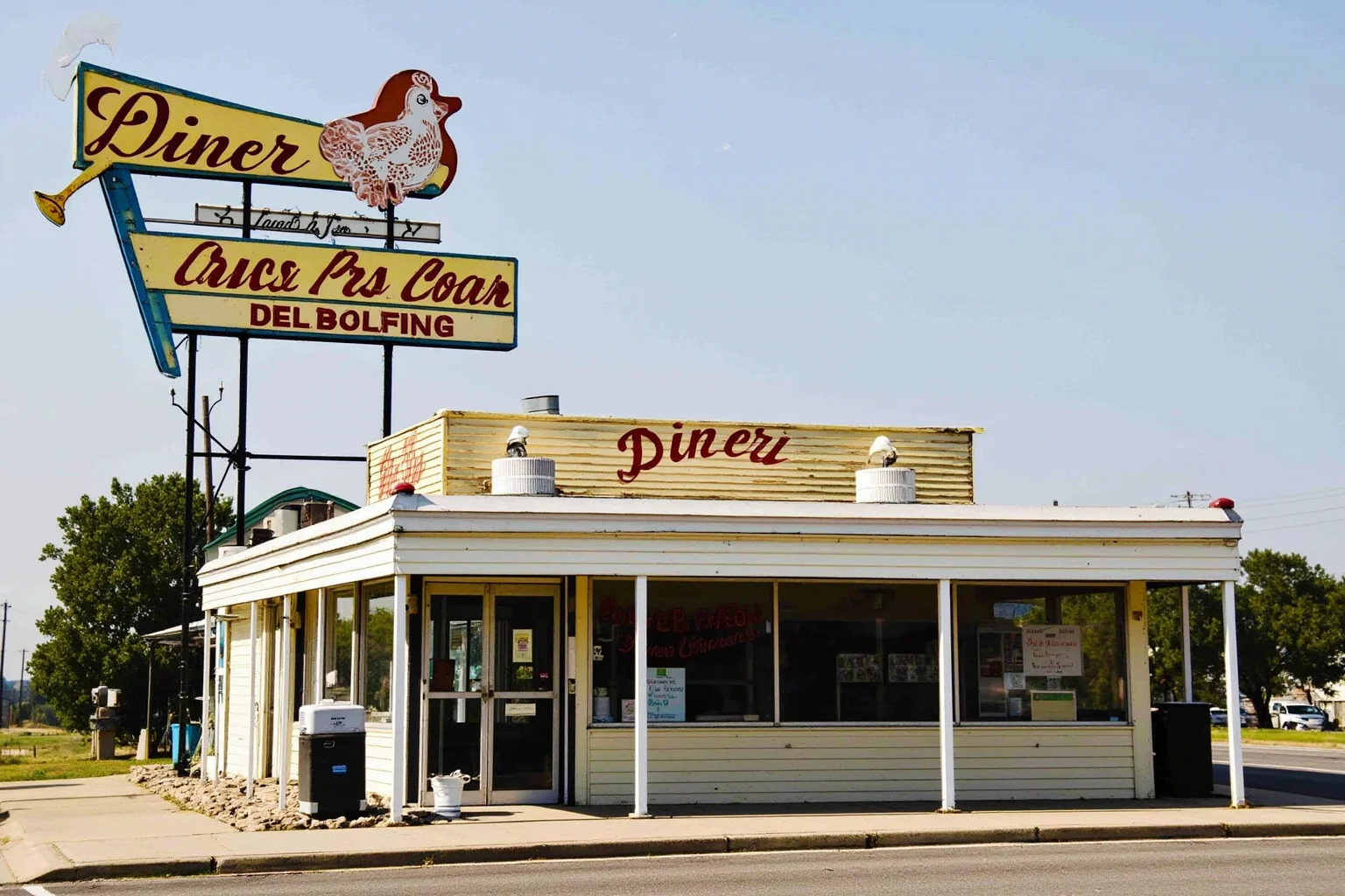 The Oldest Fast Food Chains in the World: A Full History 14 A rustic 1930s roadside diner and gas station combo with a hand-painted fried chicken sign