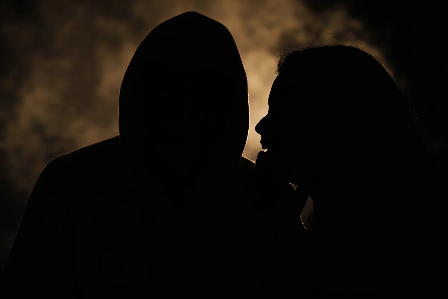 A shadowy cloaked figure whispering illusions into the ear of a thinking silhouette, dramatic lighting