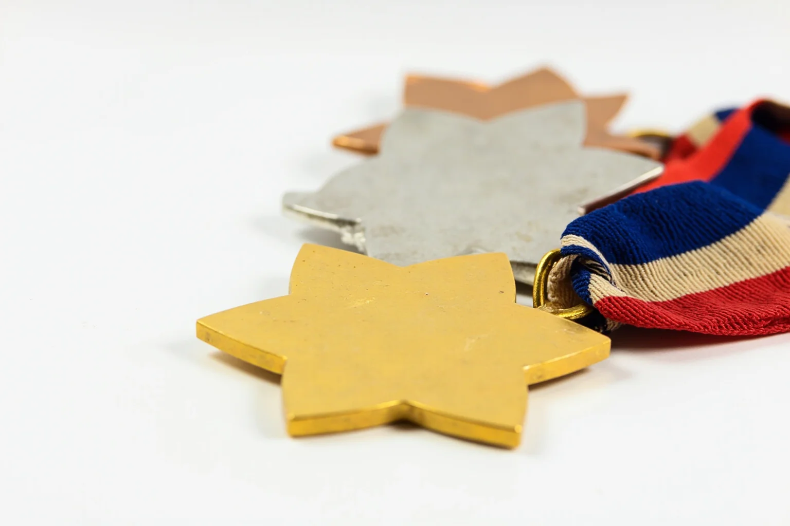 Highest Military Decorations: 20 Rare and Obsolete Medals You'll Never See Again 8 A simple star-shaped medal in three grades of bronze, silver, and gold, arranged together on a striped ribbon