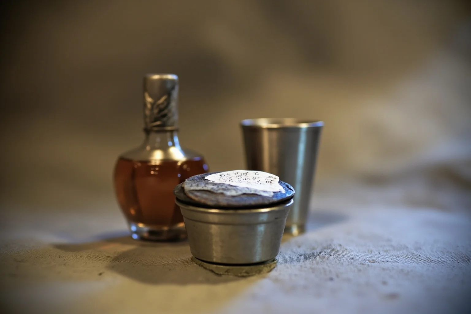 The Evolution of World War 1 Rations: 24 Facts About Food, Trenches, and Rationing 9 A small measure of rum next to a tin cup, representing the British rum ration before a dawn attack