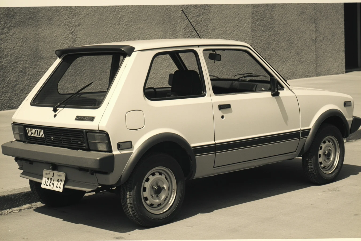 A small, oddly shaped 1970s subcompact hatchback with a chopped-off rear end