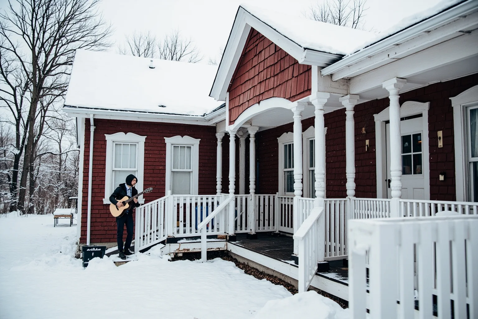 A snowy rural Canadian farmhouse with a young performer practicing songs on a porch