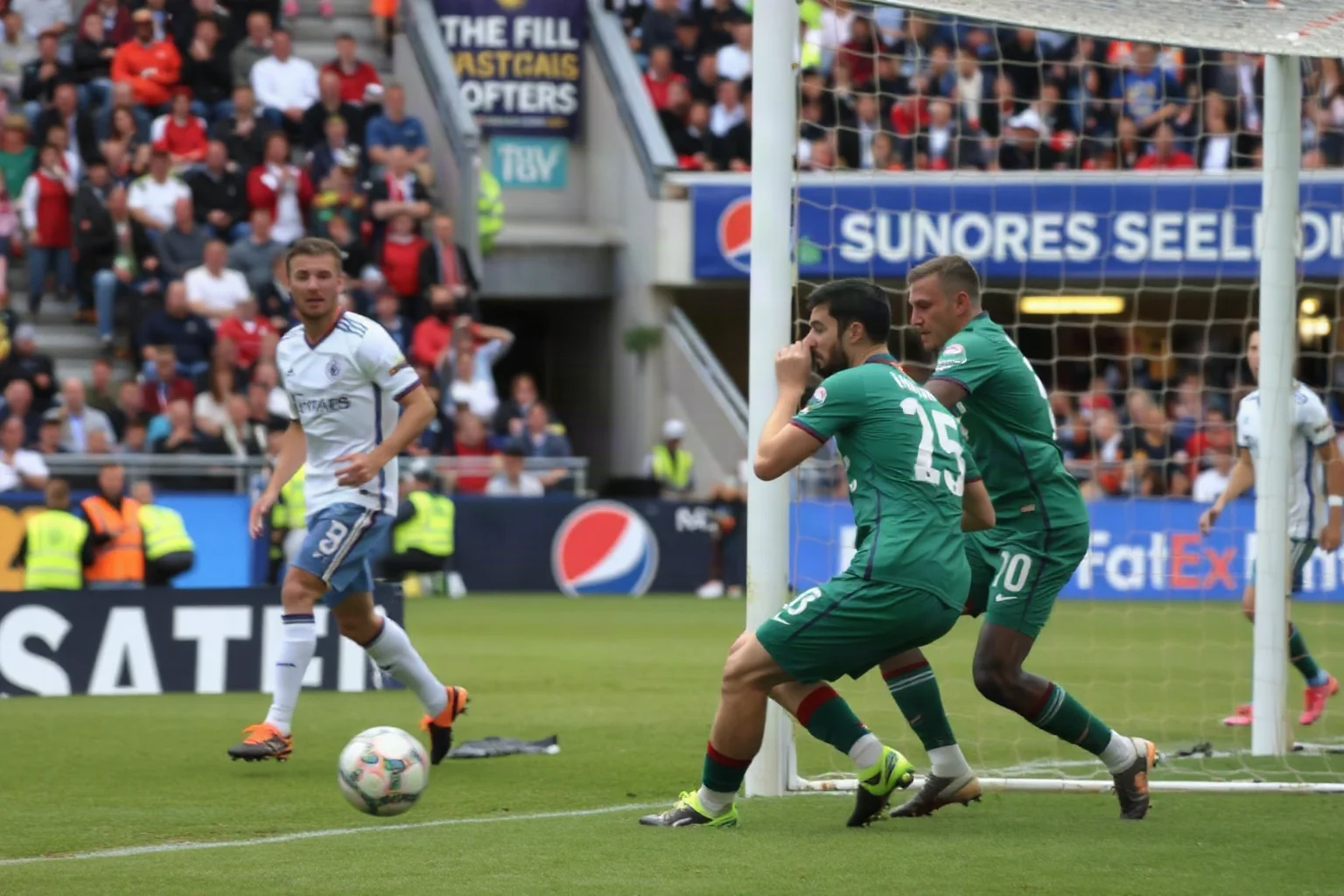 A soccer defender colliding near a goalpost during an intense match, teammates reacting with concern, stadium crowd blurred