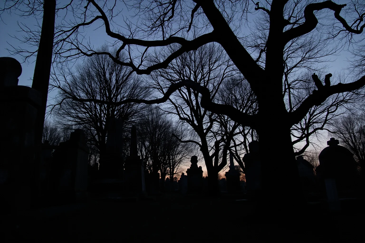 A somber 18th-century cemetery scene at dusk with simple stone markers and bare trees