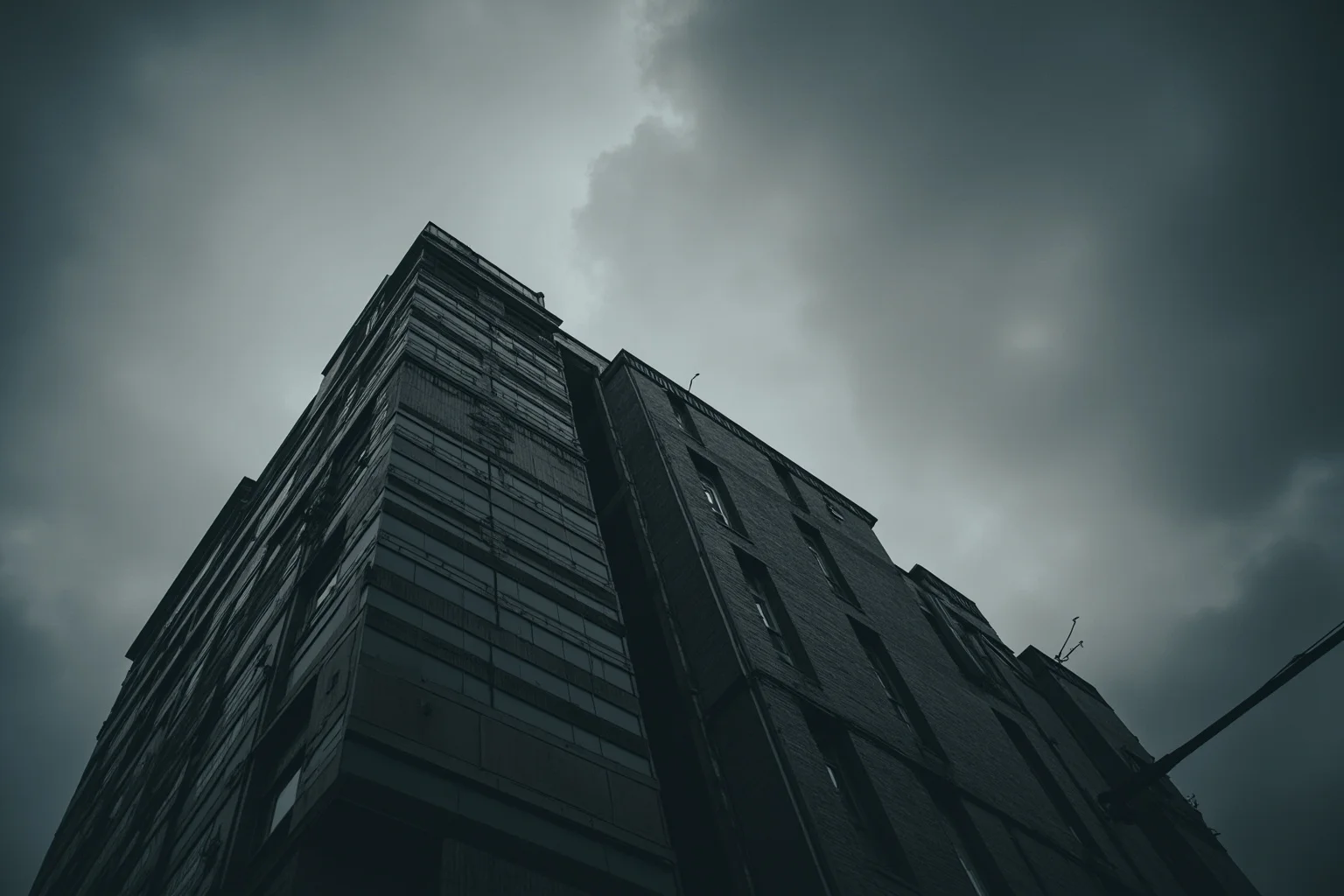 A somber Wall Street-style office building facade under a stormy gray sky