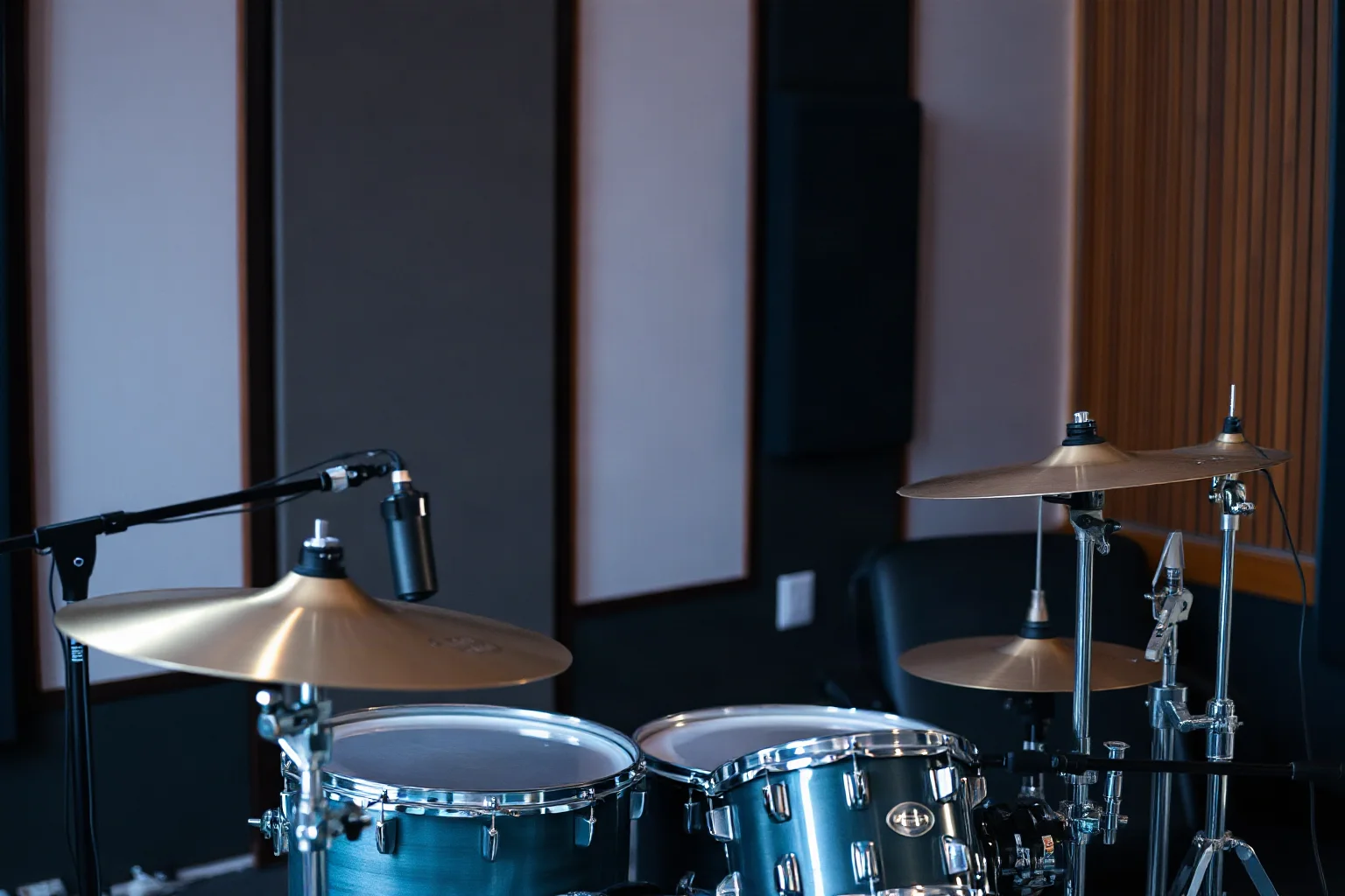 A technically precise studio drummer playing a complex fill in a modern recording studio