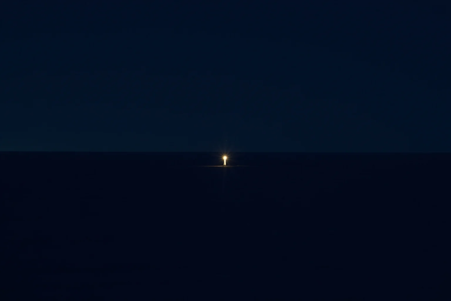 Strange History: Why Lighthouse Keepers Went Mad (Or Did They?) 20 A tiny illuminated lighthouse surrounded by vast dark ocean, symbolizing isolation, minimalist night illustration