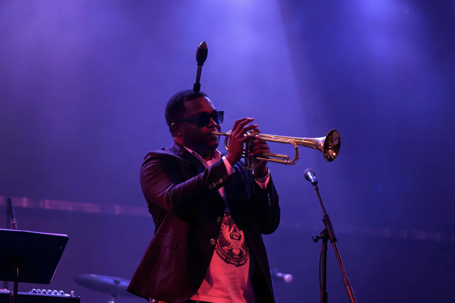 A trumpeter with a distinctive upward-bent horn performing energetically on a small jazz club stage