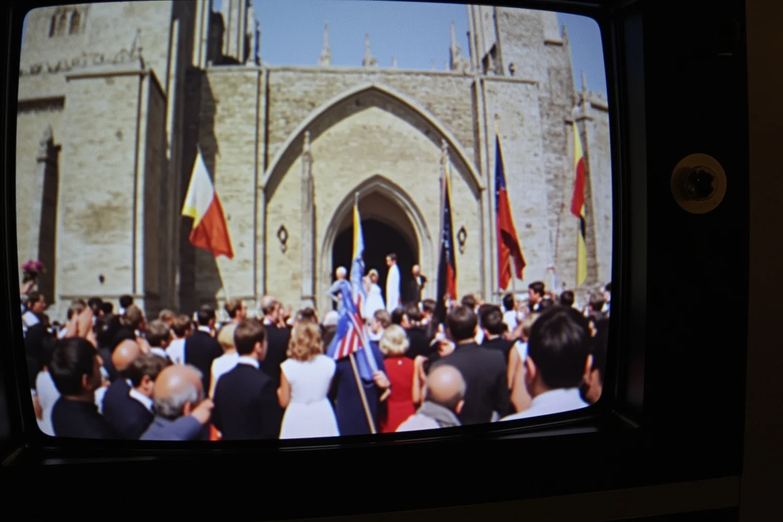 Most Important Historical Events Televised Live 9 A vintage TV screen showing a grand cathedral wedding ceremony with crowds outside waving flags