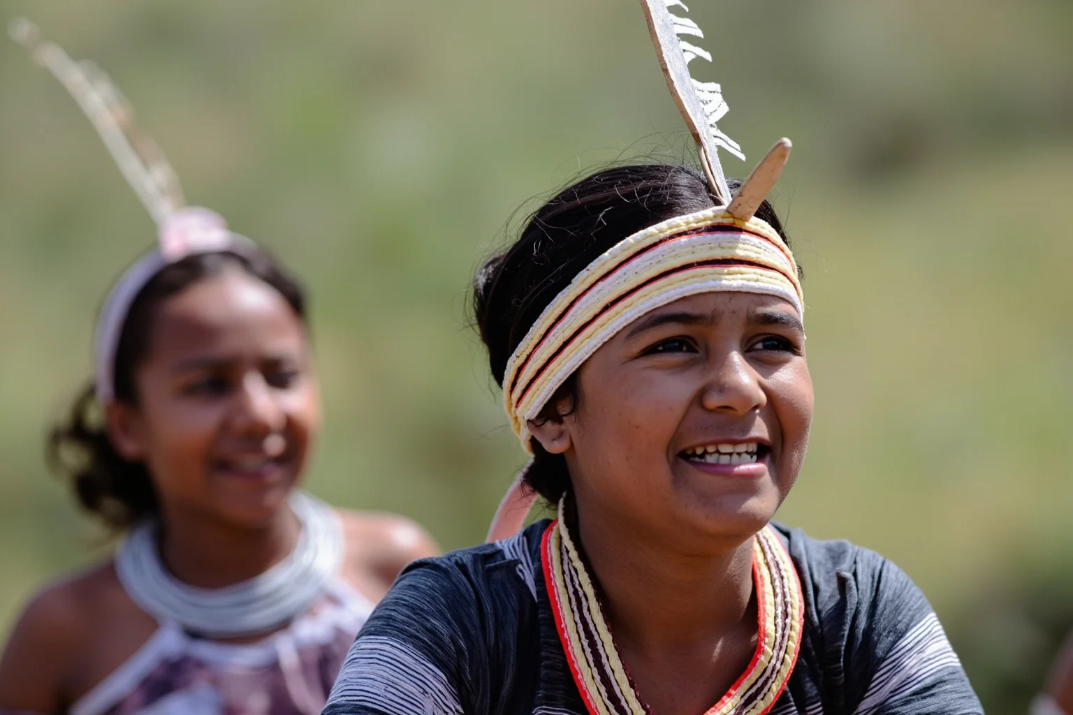 A young Indigenous woman in traditional dress participating in an outdoor coming-of-age ceremony