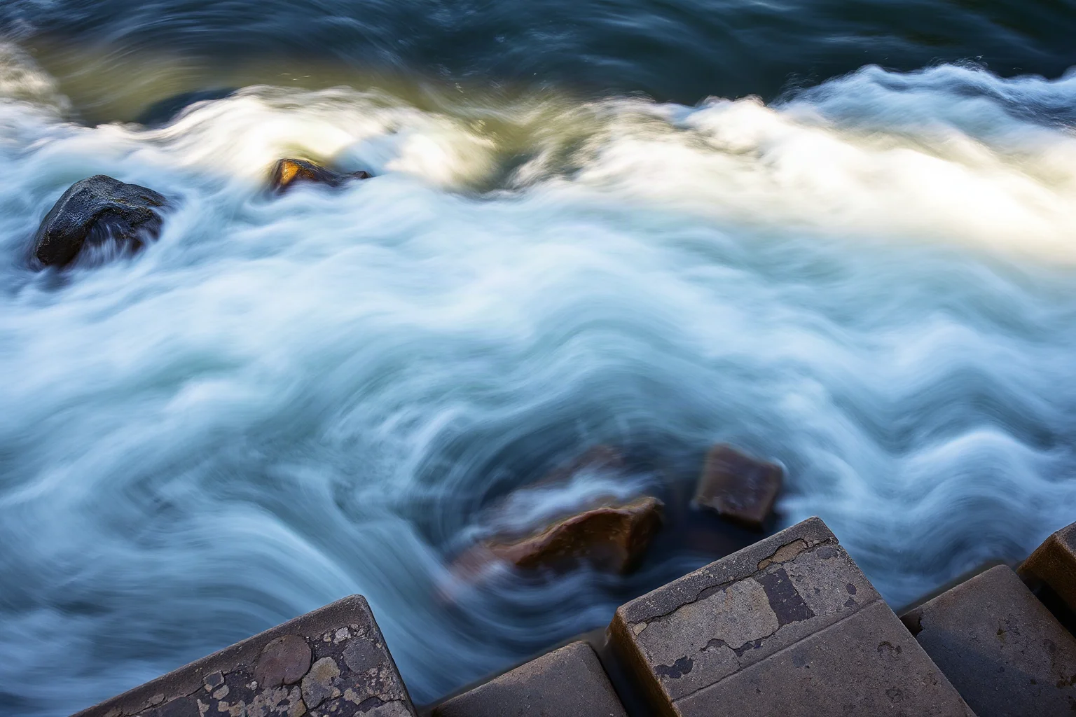 Abstract illustration of swirling water and changing light over stone steps, symbolizing constant change