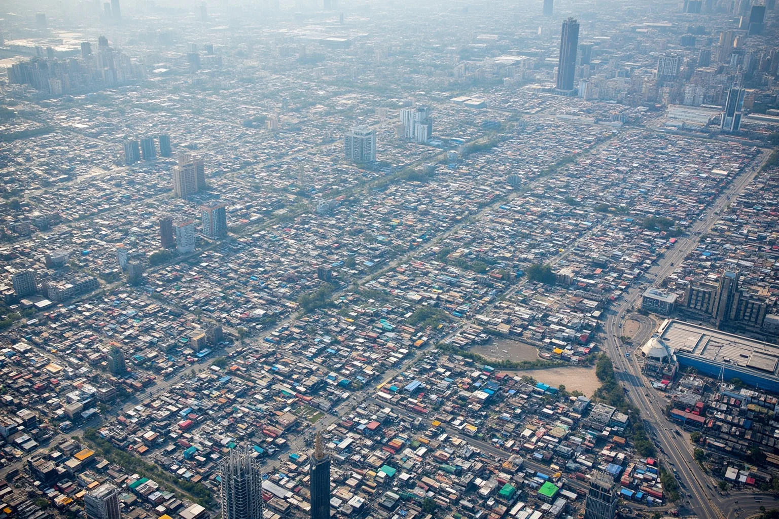 Aerial view of a massive modern wholesale trade market complex in Yiwu, China with countless organized stalls