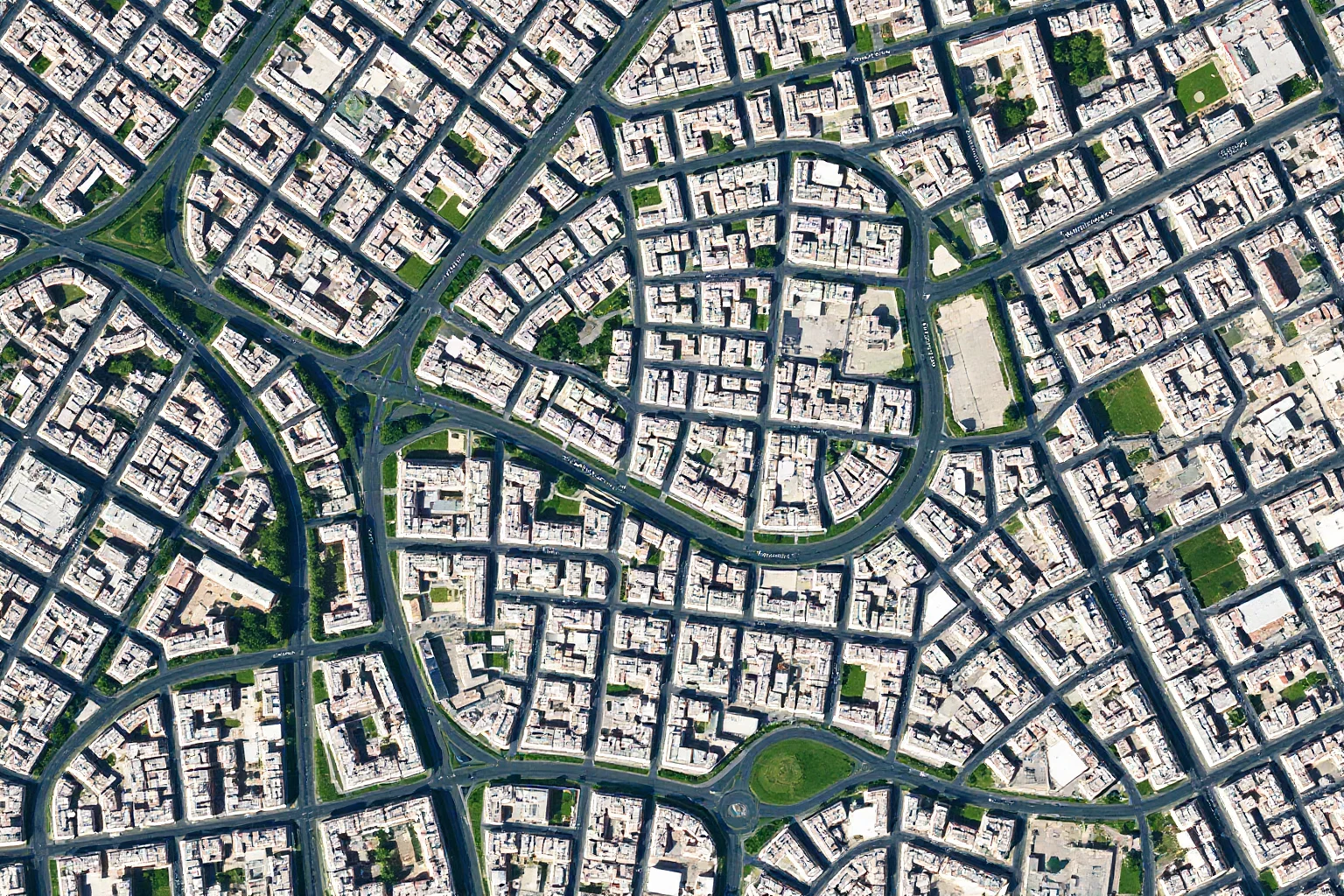 Aerial view of Paris showing the Left Bank arrondissements (5th, 6th, 14th) with street grid, indicating the honeycomb of tunnels beneath the city streets