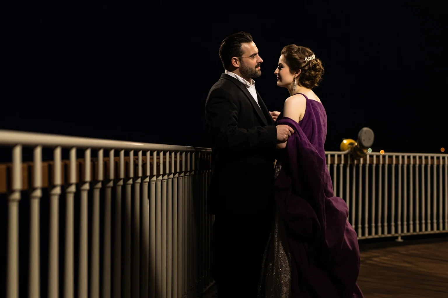 Historical Figures Who Boarded the Titanic — And 10 Who Didn't Survive 15 An elegant Edwardian couple in formal attire standing arm in arm near a ship's railing at night