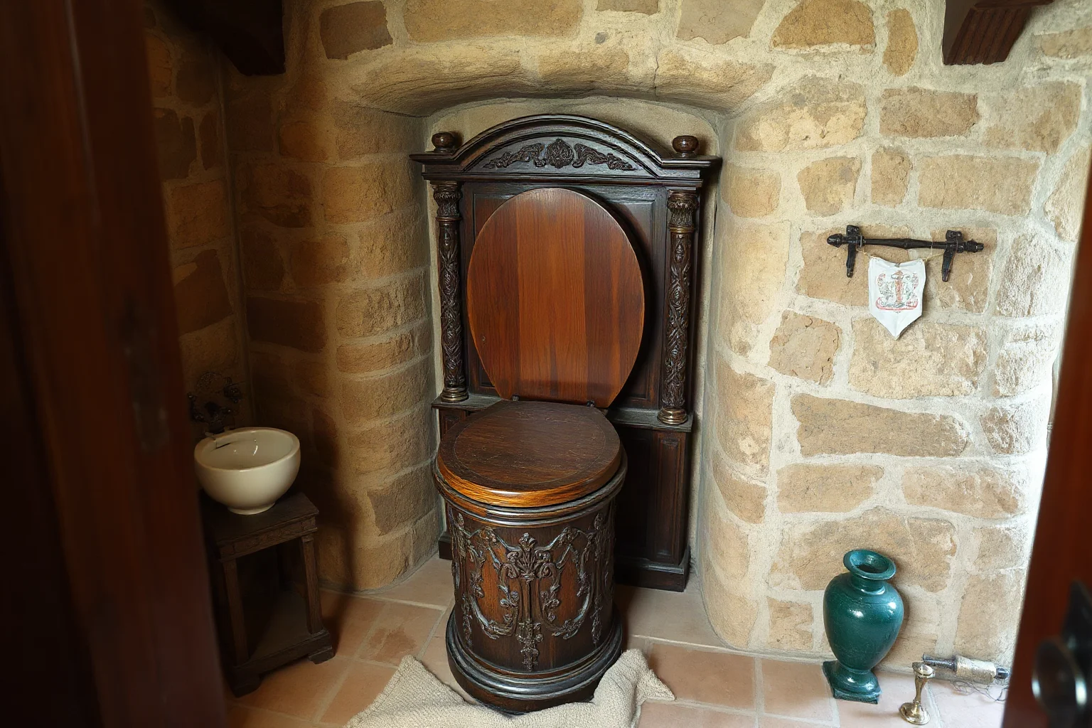 An ornate Elizabethan-style flush toilet with a wooden cistern in a stone-walled chamber