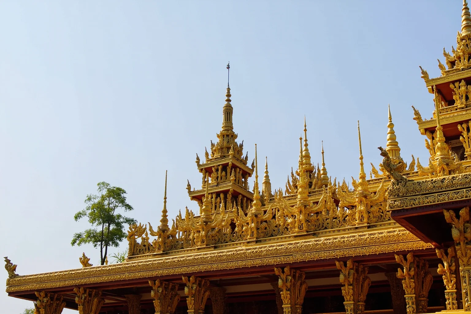 An ornate Southeast Asian royal pavilion with golden spires representing the Kingdom of Cambodia