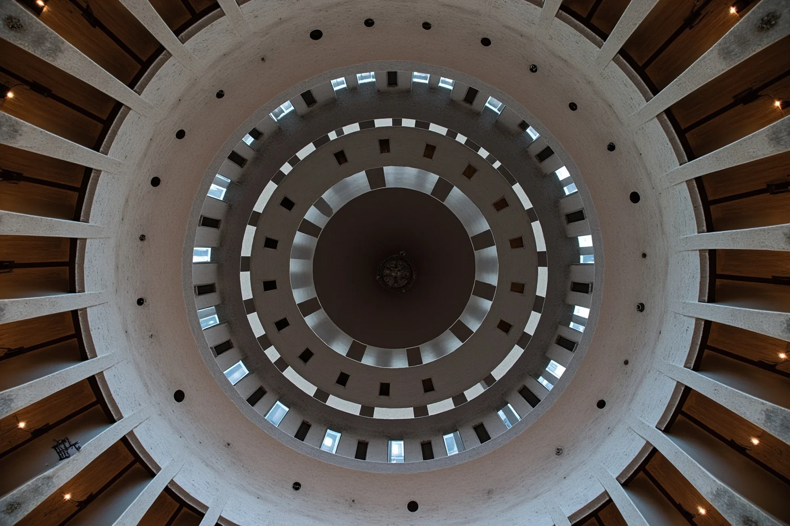 Architectural photo of a curved ribbed concrete ceiling structure in a mid-century modern auditorium