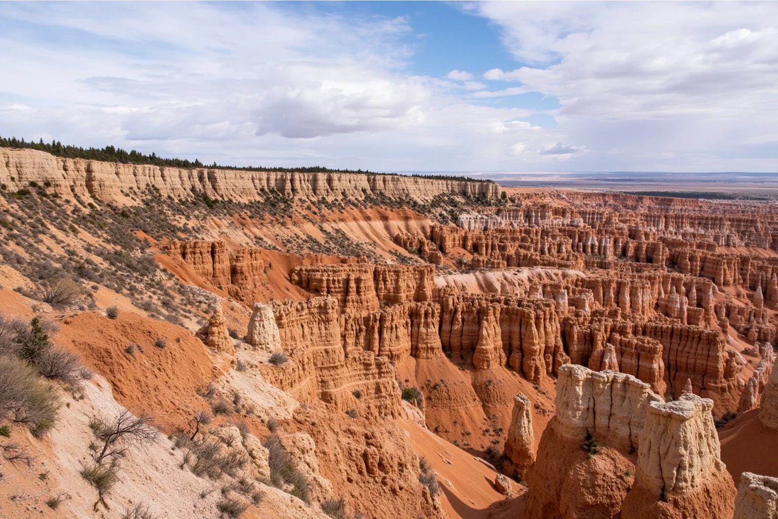 Canadian prairie badlands with eroded hoodoos and exposed sedimentary rock layers