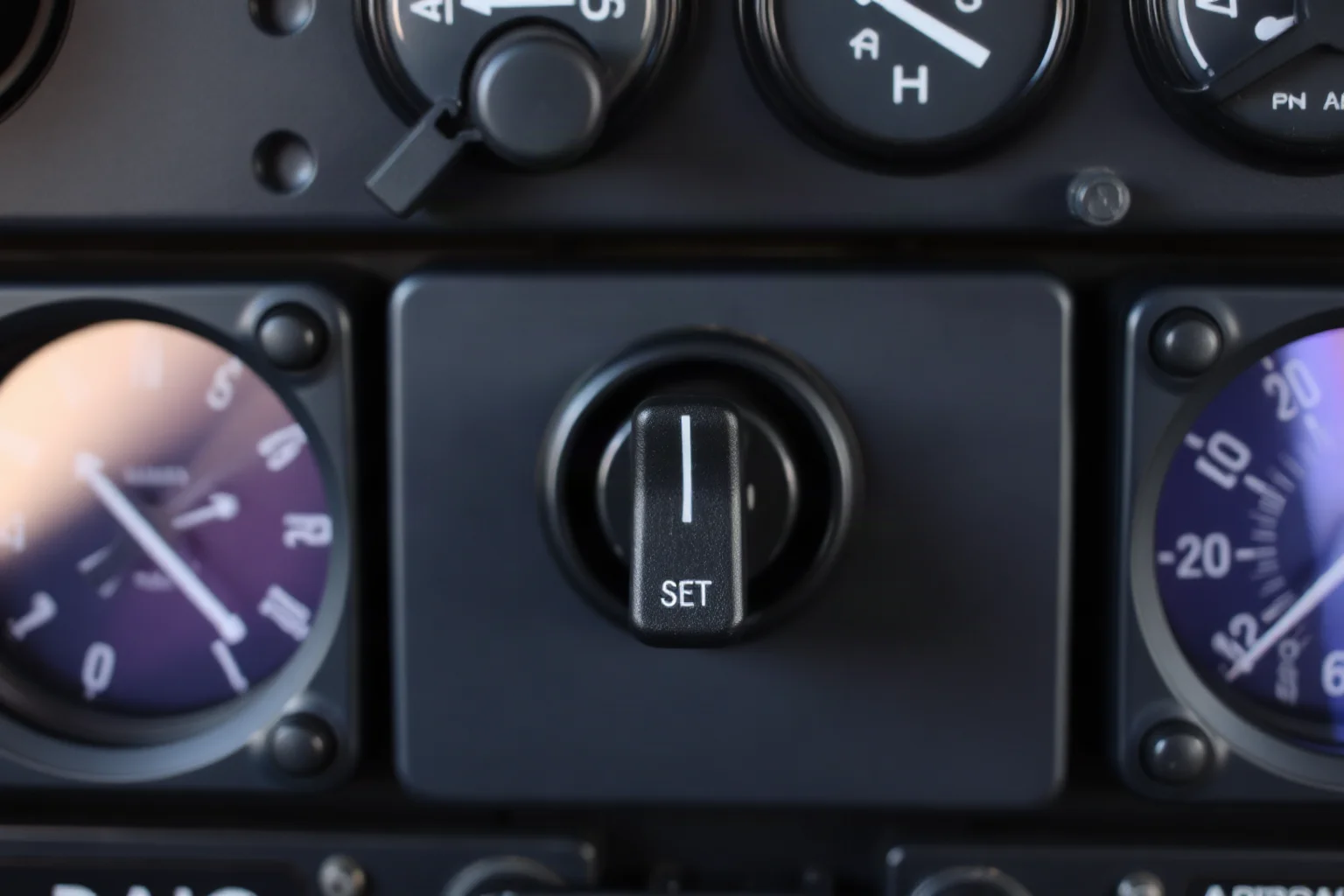 Close-up illustration of an airplane cockpit pressurization control panel with a switch set to manual