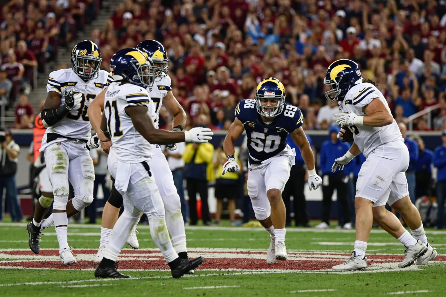 Biggest Blowouts in Sports History 19 College football stadium with underdog team players celebrating a blocked field goal to seal a huge upset