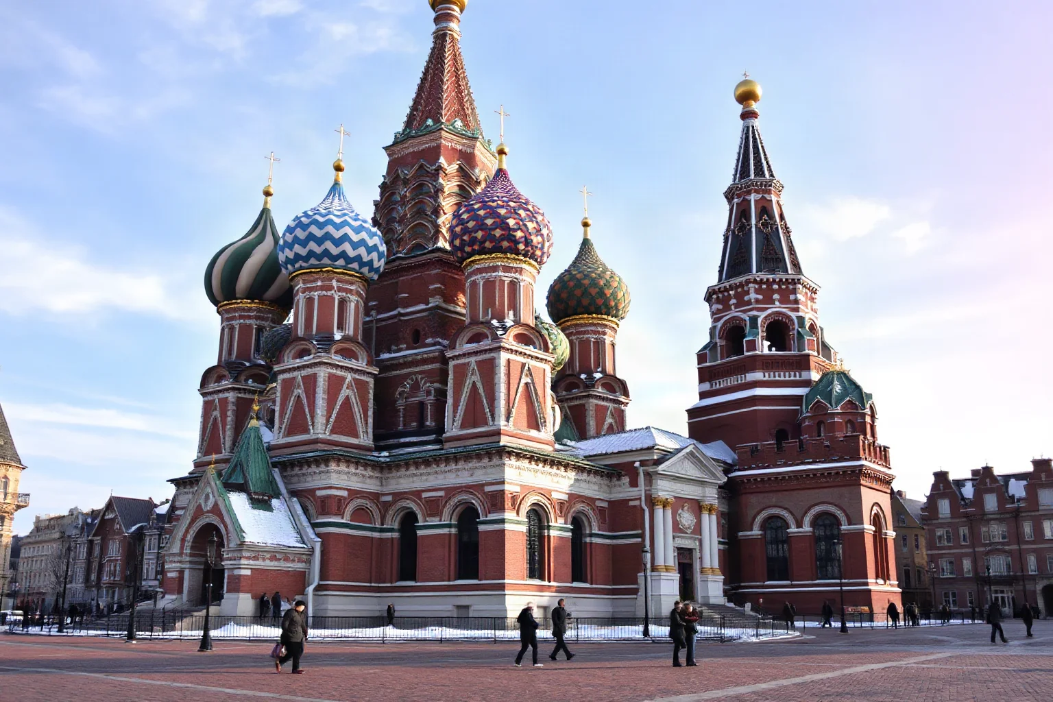 Colorful onion-domed cathedral with swirling patterns against a red brick square, winter light, iconic skyline shot