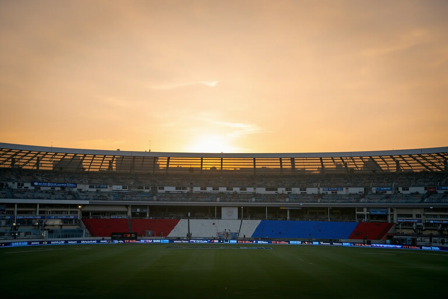 26 of History's Most Famous Rivalries 17 Cricket stadium at golden hour with two rival national flag colors draping the stands