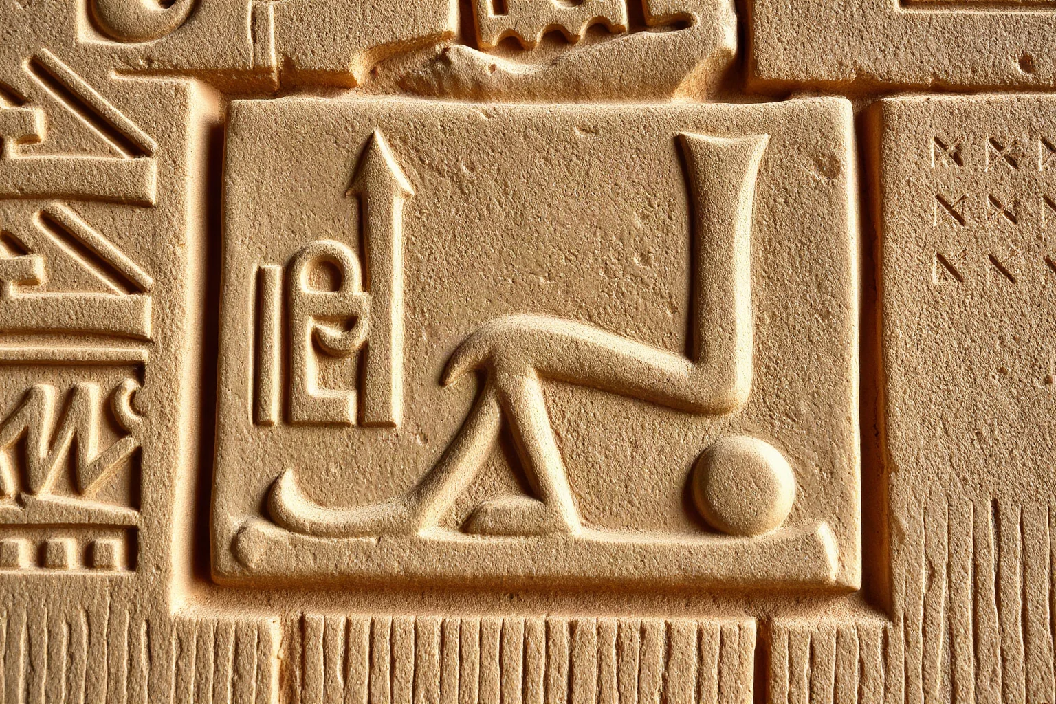 Detailed Egyptian royal titulary cartouche carved into sandstone