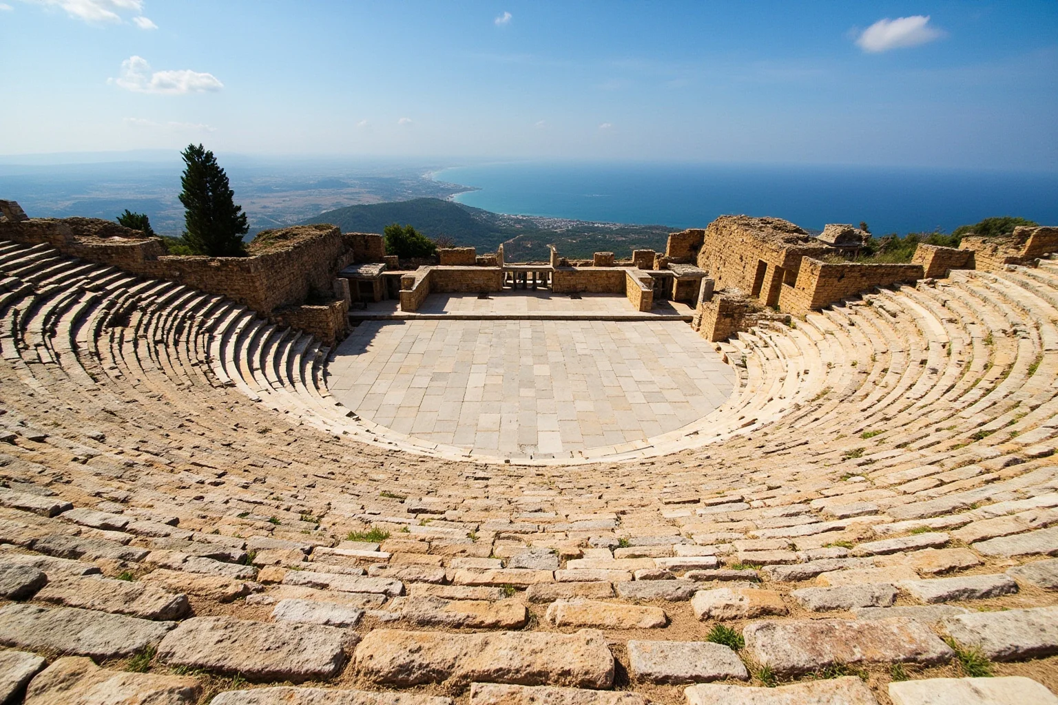 Hilltop ancient Greek theatre of Segesta in Sicily with distant sea and countryside views in the background