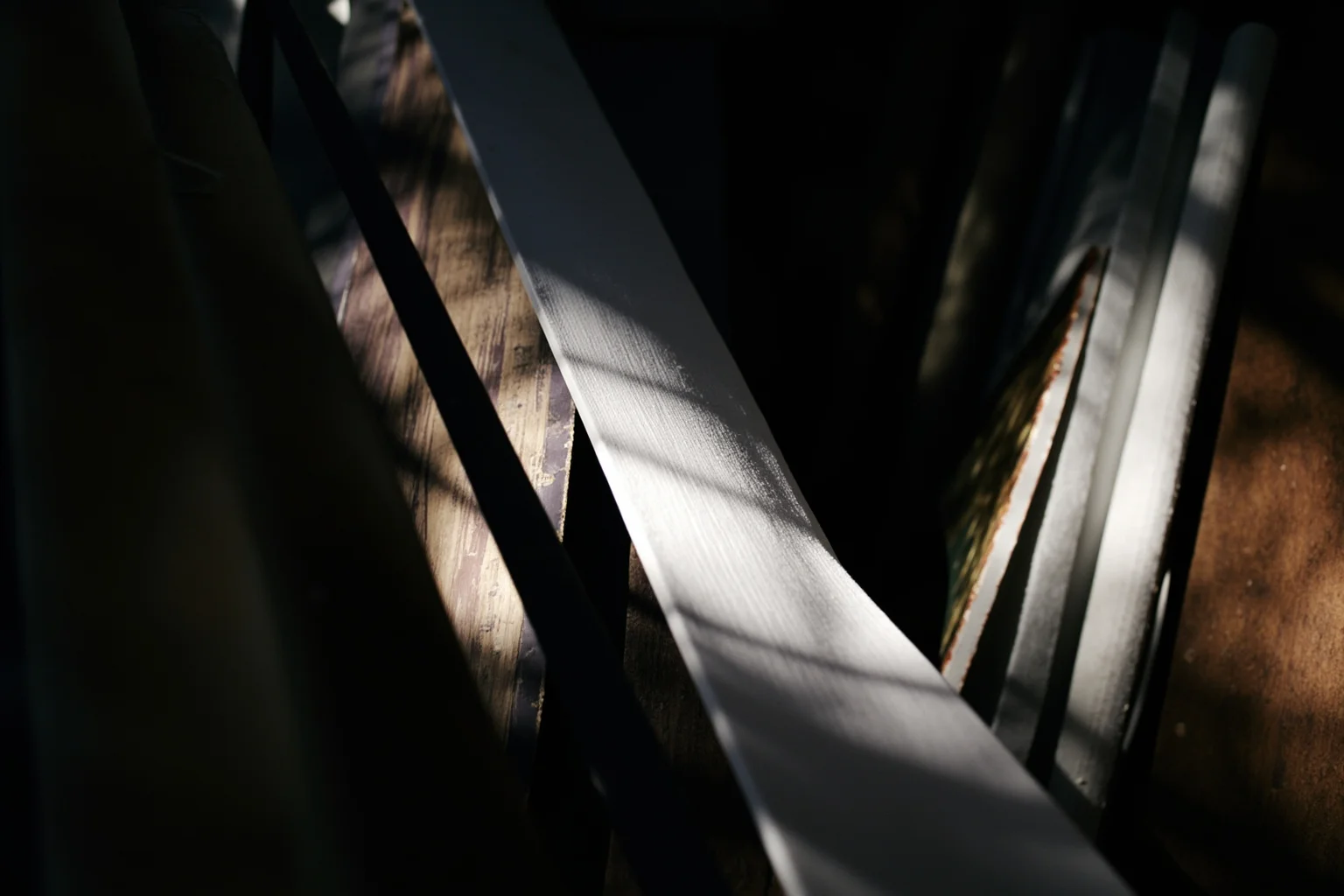 The Louvre Is No Stranger to Losing Millions: Inside the Museum's Biggest Heists 14 Illustration of rolled canvas paintings hidden inside a dumpster, dramatic shadow lighting