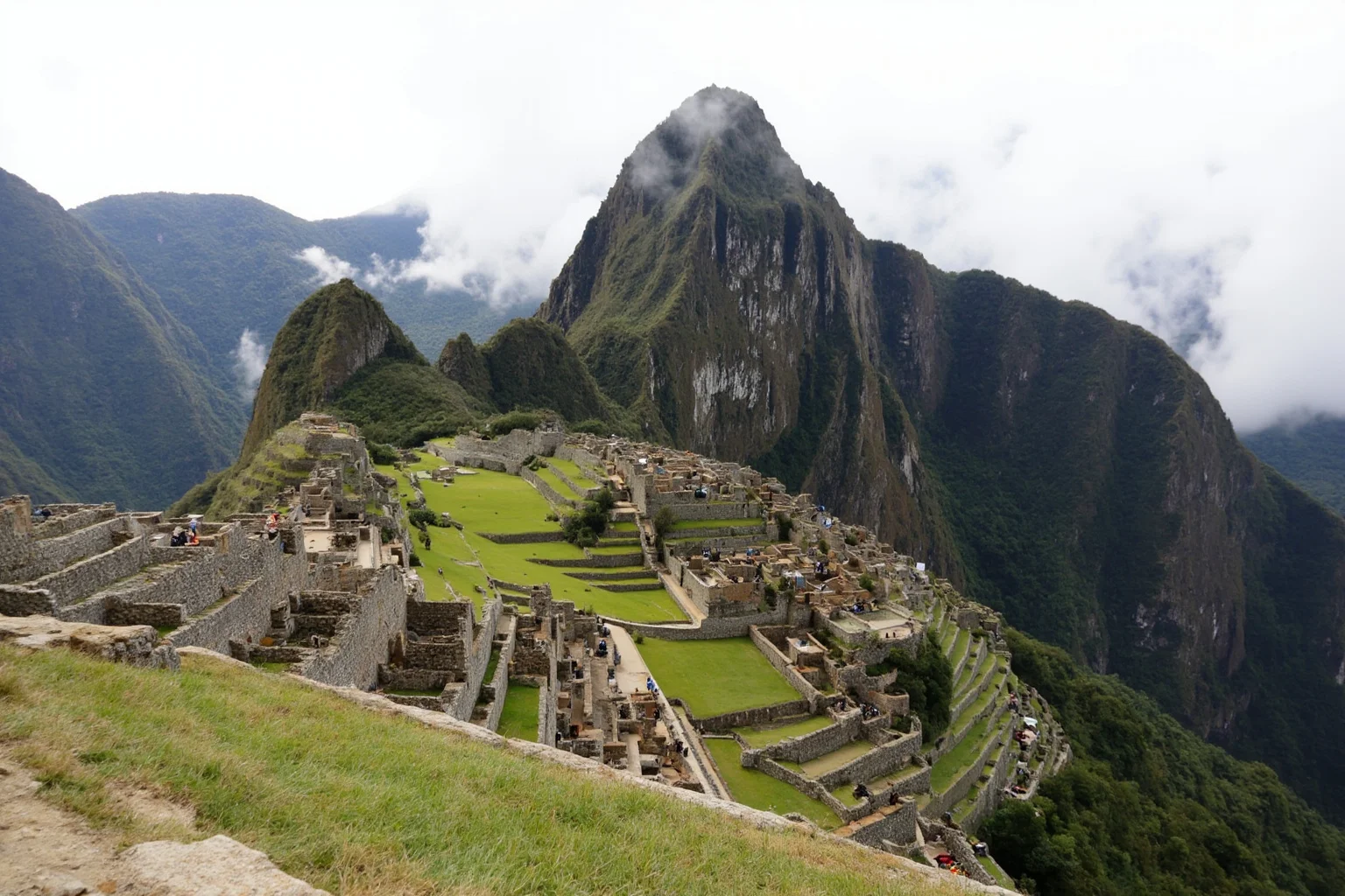 Machu Picchu's stone terraces and temples nestled among misty Andean peaks