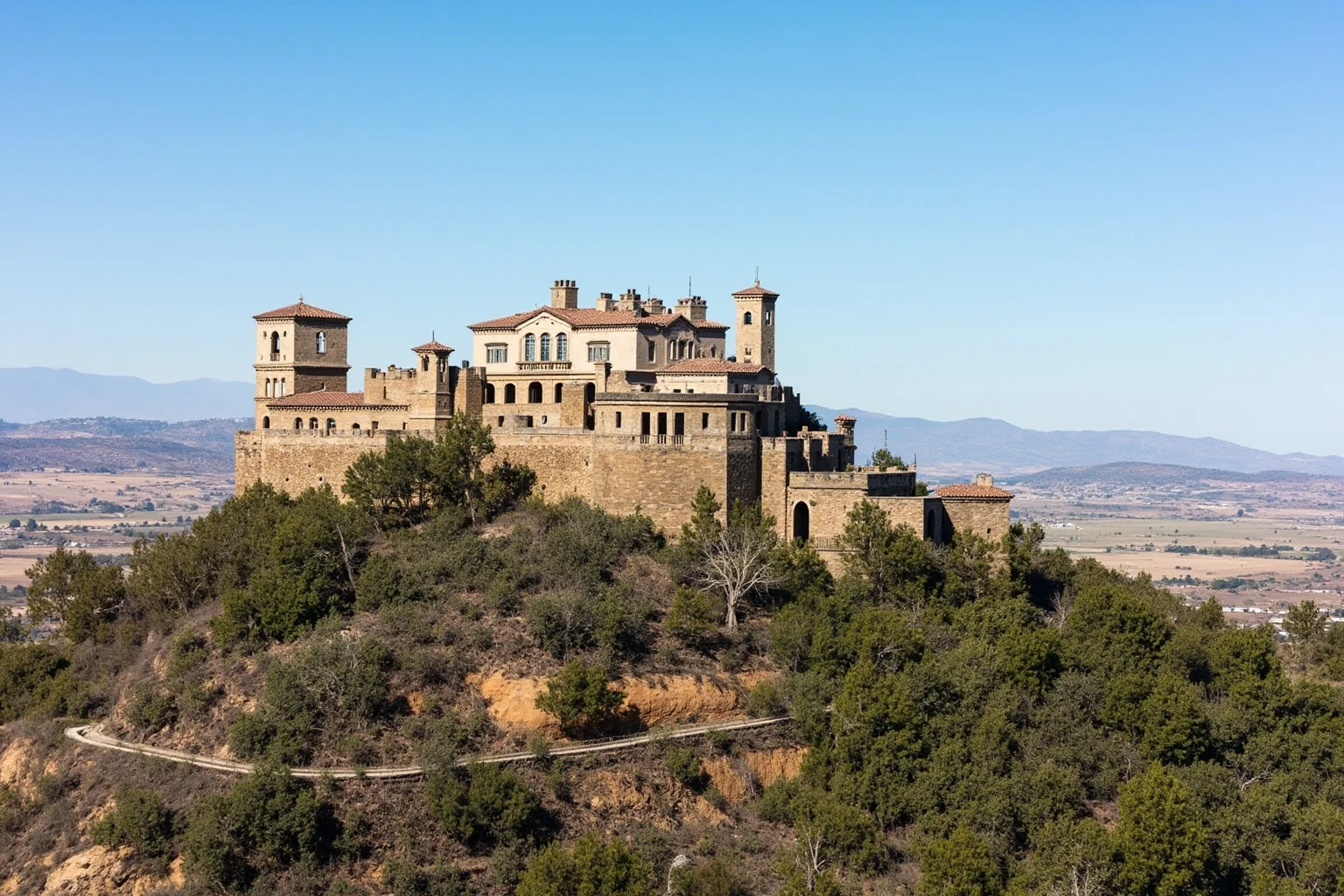 25 Famous American Historical Homes You Can Still Visit Today 12 Mediterranean Revival hilltop castle with towers and terraces overlooking rolling California hills