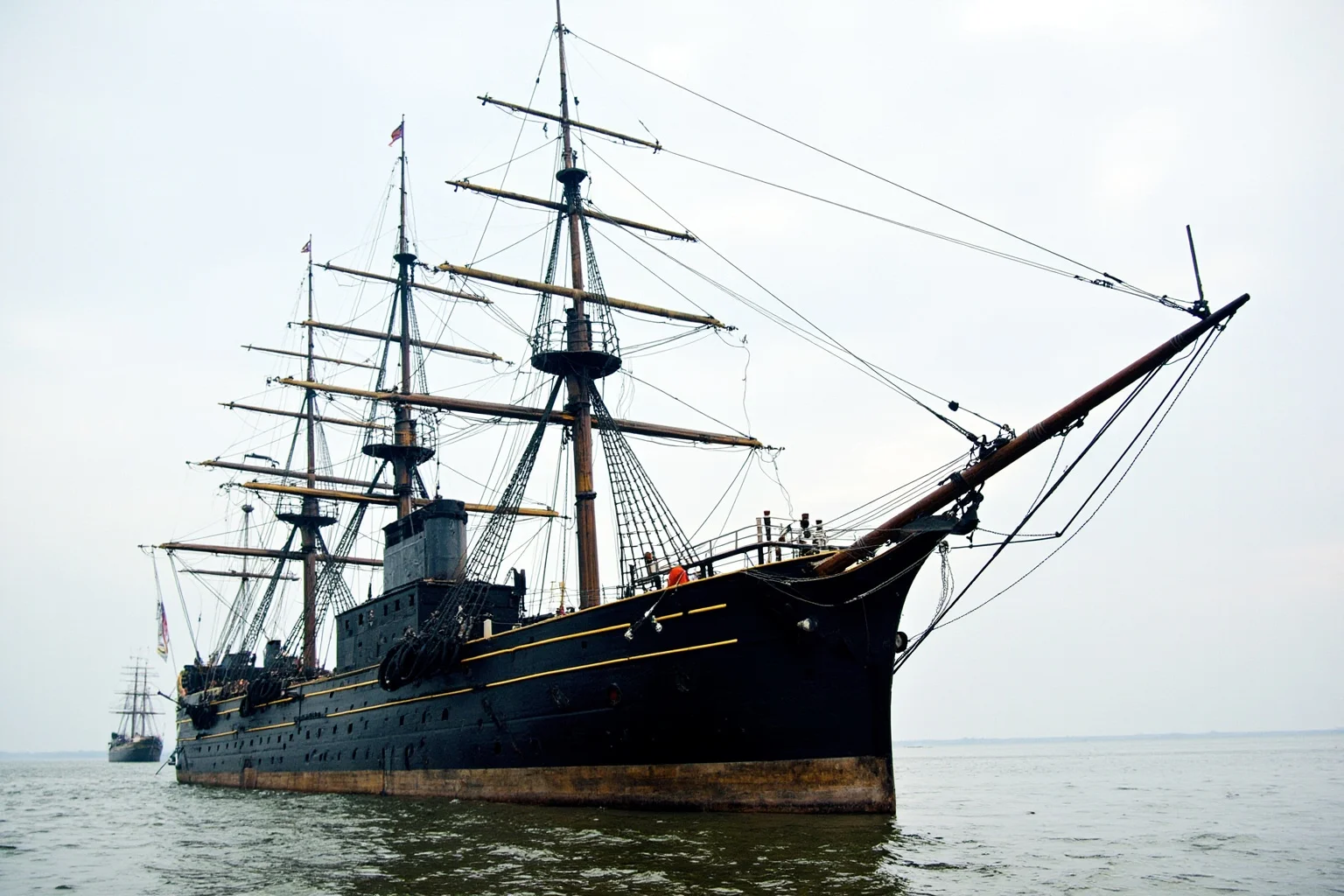 The Longest-Serving Warships of All Time 10 Mid-19th-century black iron-hulled armored warship with a single smokestack and full sail rig, pioneering ironclad design