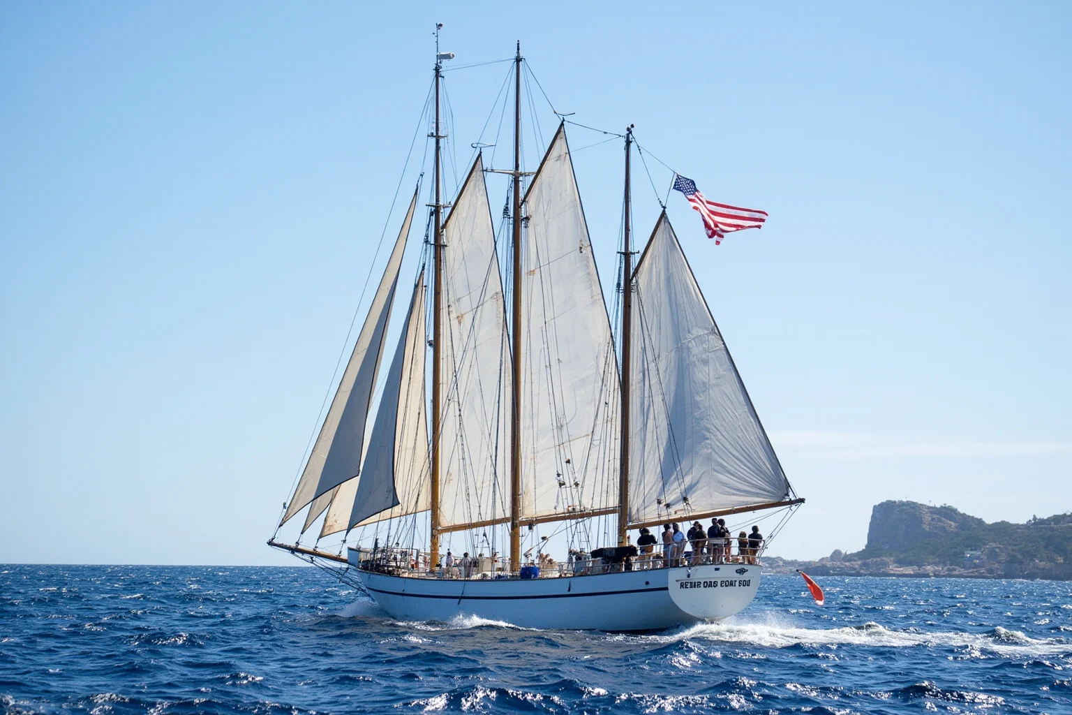 The Longest-Serving Warships of All Time 20 Modern four-masted white sail training ship with cadets on deck, ocean waves, bright sunny day at sea