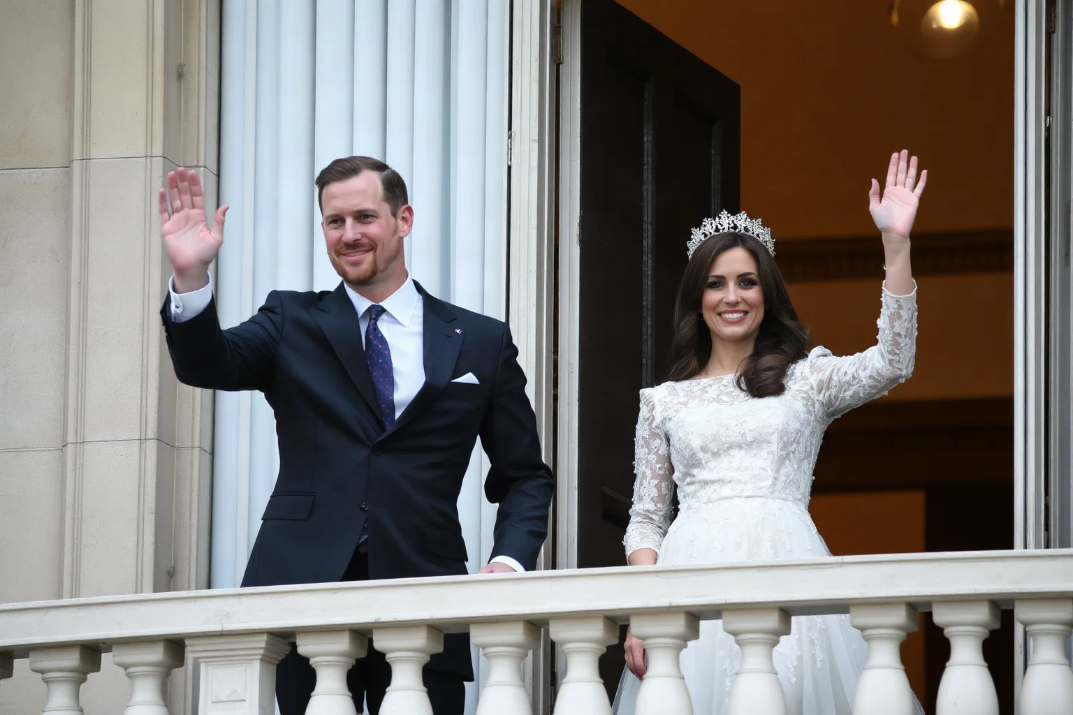 Modern royal couple in elegant formal wear waving from a palace balcony